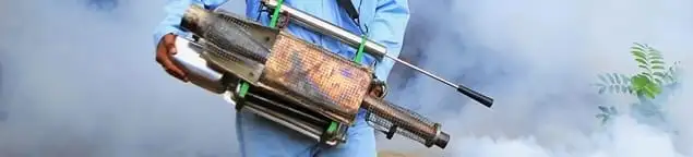 Fumigation technician using a fogger for deep pest treatment in Tucson, AZ